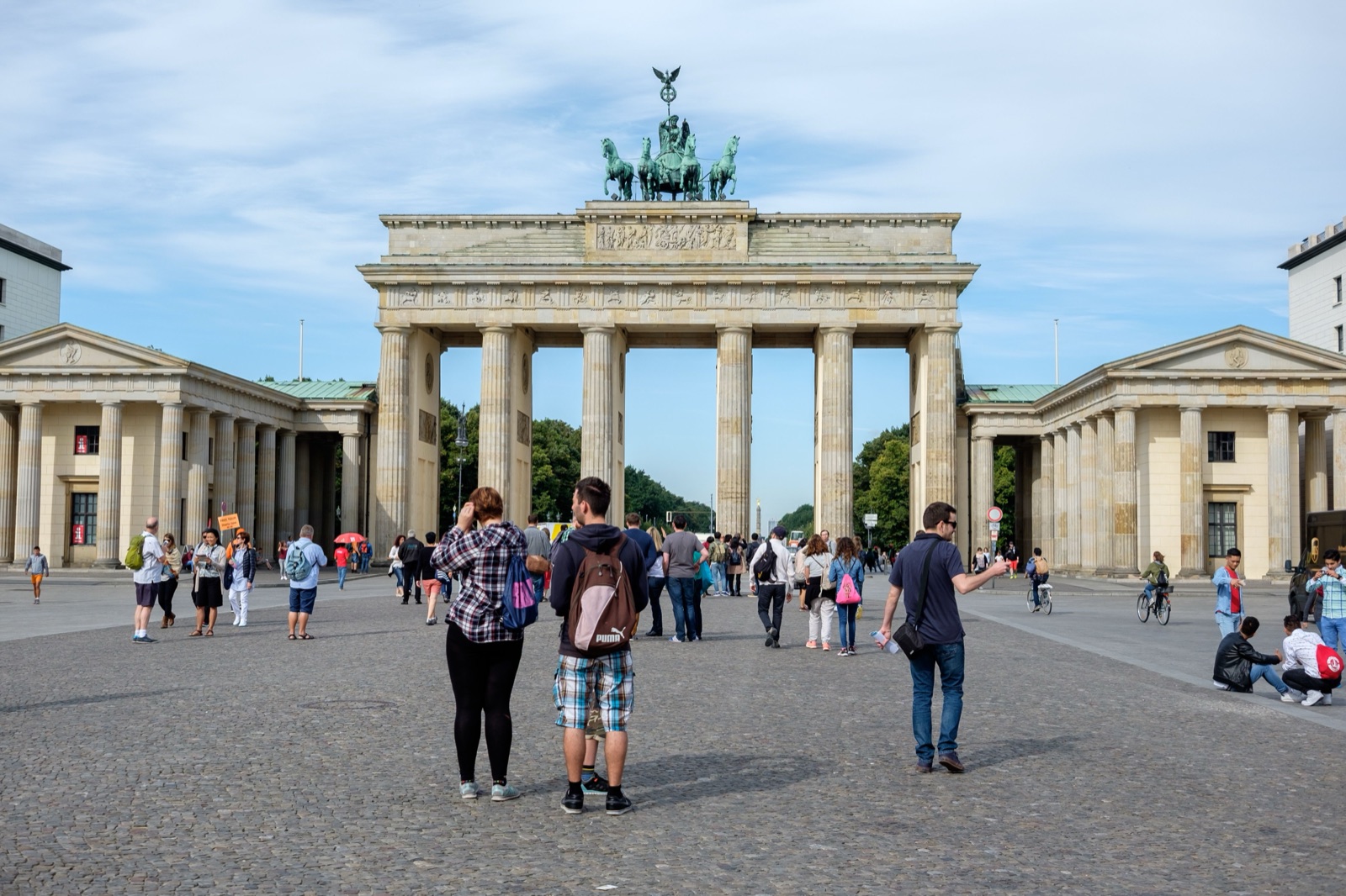 The original photograph of the Brandenburg Gate in Berlin with a few people in front of it.