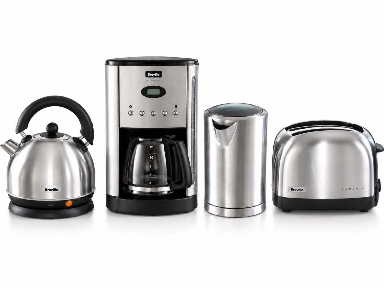 The same four stainless steel kitchen appliances, a dome kettle, a coffee maker, a tall kettle and a toaster, evenly spaced on a clean white background with soft light.
